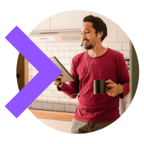 Person taking video call from home standing in kitchen with coffee